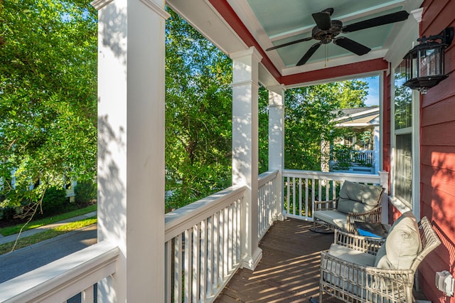 deck with a porch and a ceiling fan
