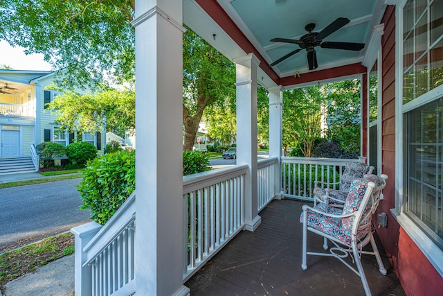 balcony featuring a ceiling fan and a porch