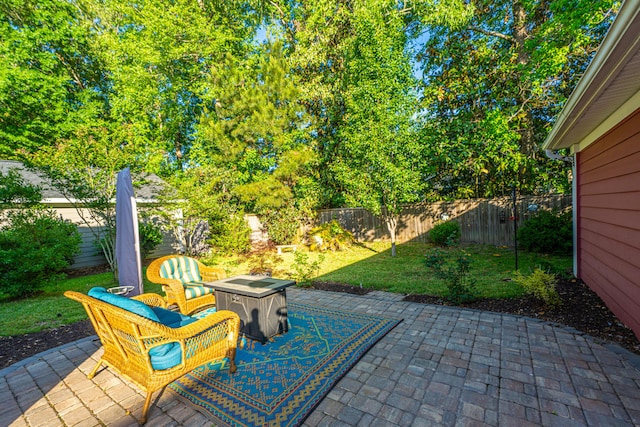 view of patio / terrace featuring a fenced backyard and an outdoor fire pit