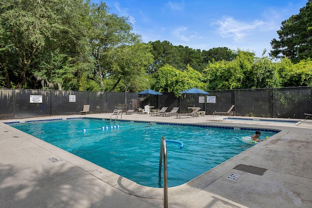 view of swimming pool featuring a patio area