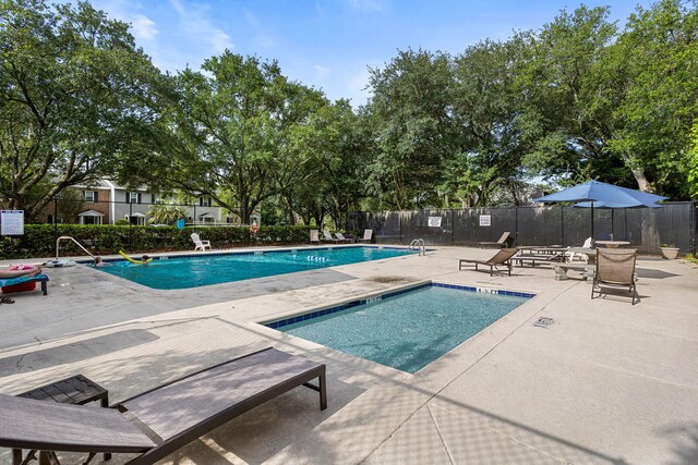 view of swimming pool featuring a patio