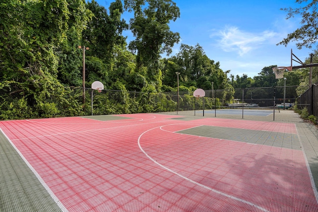 view of basketball court featuring tennis court