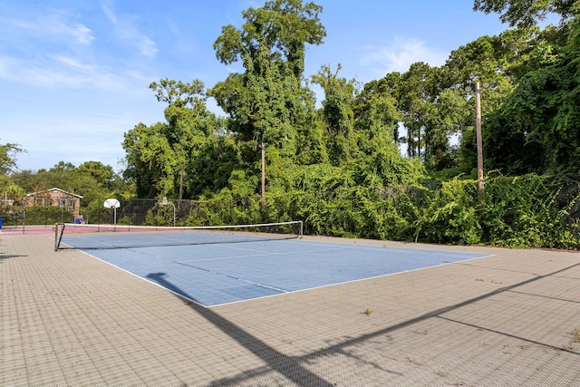 view of tennis court featuring basketball court