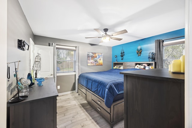 bedroom featuring ceiling fan and light wood-type flooring