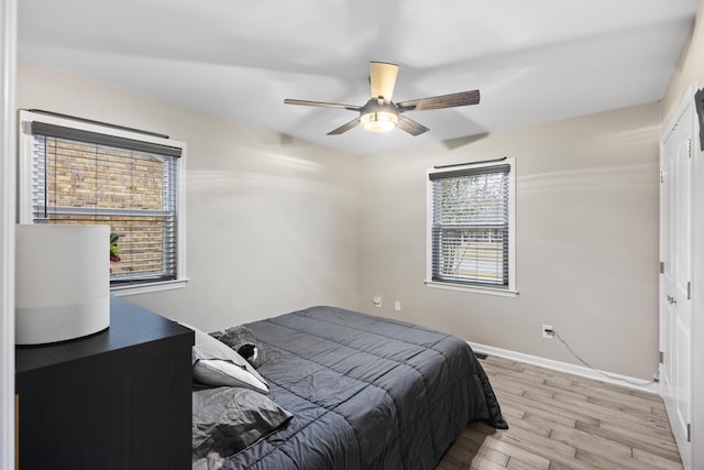 bedroom featuring ceiling fan and light hardwood / wood-style floors