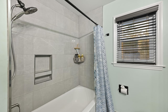 bathroom featuring shower / tub combo with curtain