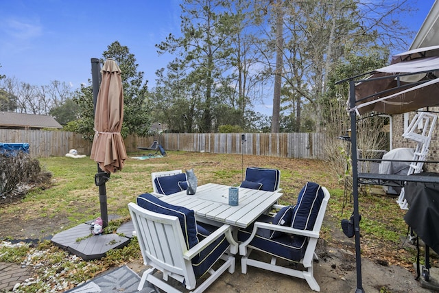 view of patio featuring a grill