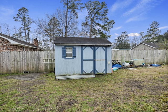 view of outbuilding featuring a yard