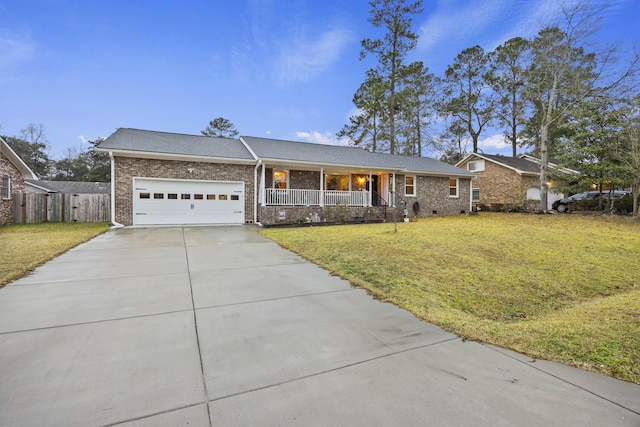 single story home with a garage, a front lawn, and covered porch