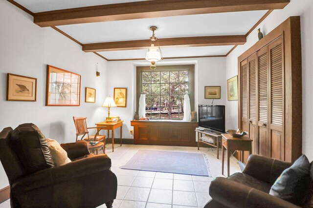 living area featuring baseboards, beam ceiling, ornamental molding, and light tile patterned flooring