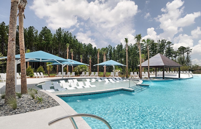 community pool featuring a gazebo and a patio area