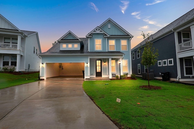 view of front of property featuring driveway, board and batten siding, and a front yard