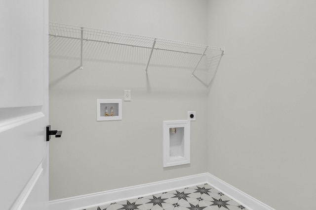 laundry area featuring laundry area, washer hookup, baseboards, light floors, and electric dryer hookup