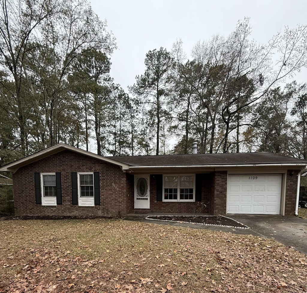 single story home with a garage