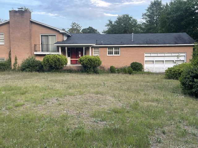 495 Majority Rd, Orangeburg, SC 29118 - split level home with an attached garage, a chimney, a porch, and brick siding