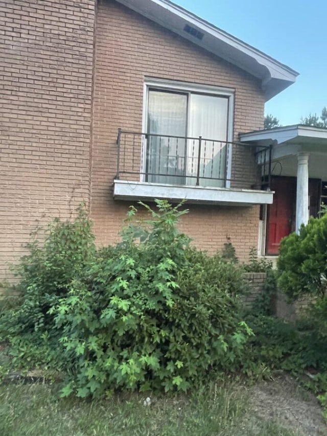 495 Majority Rd, Orangeburg, SC 29118 - view of property exterior with a balcony and brick siding