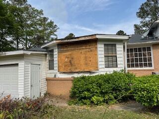 495 Majority Rd, Orangeburg, SC 29118 - view of side of home featuring a garage and brick siding