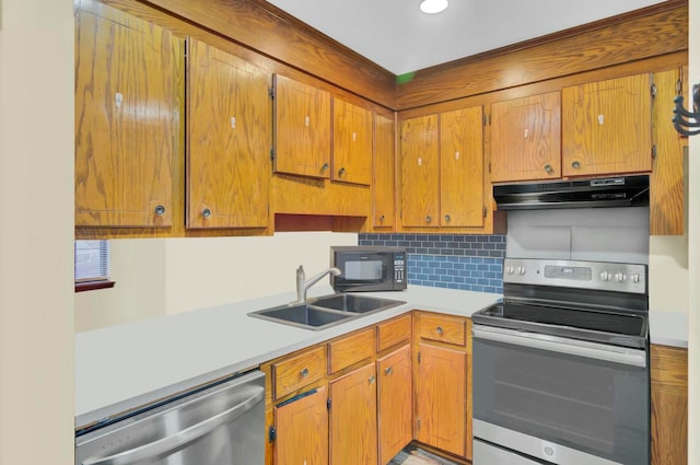 kitchen with decorative backsplash, sink, and stainless steel appliances