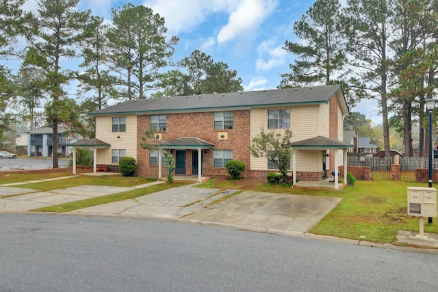 view of property featuring a front yard