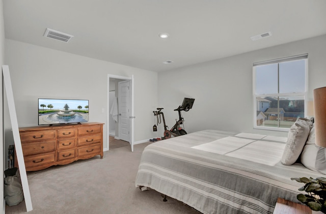 bedroom featuring light carpet