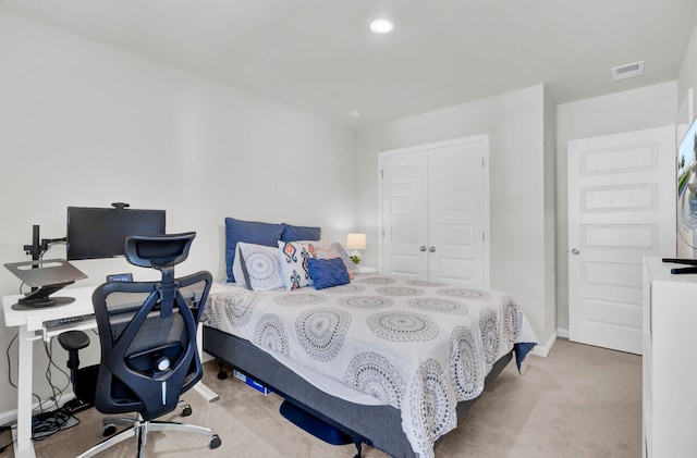 carpeted bedroom with a closet