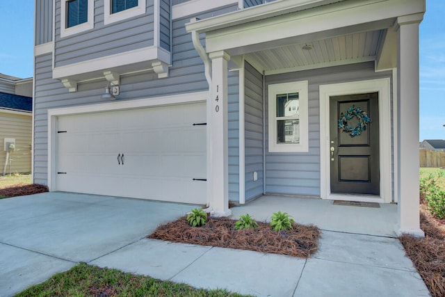 doorway to property featuring a garage