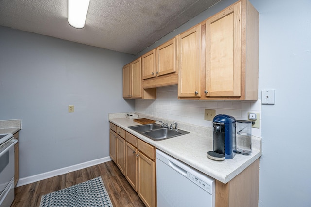 kitchen featuring a sink, light countertops, decorative backsplash, white appliances, and dark wood-style flooring