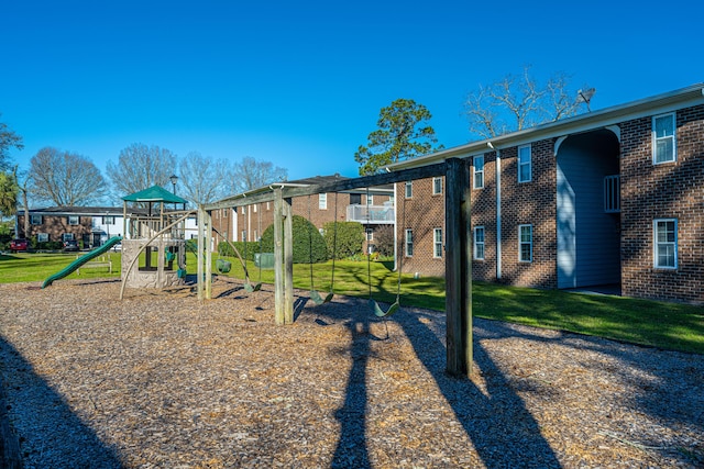 exterior space with playground community, a residential view, and a yard