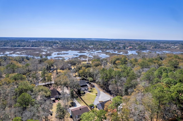 aerial view with a forest view and a water view