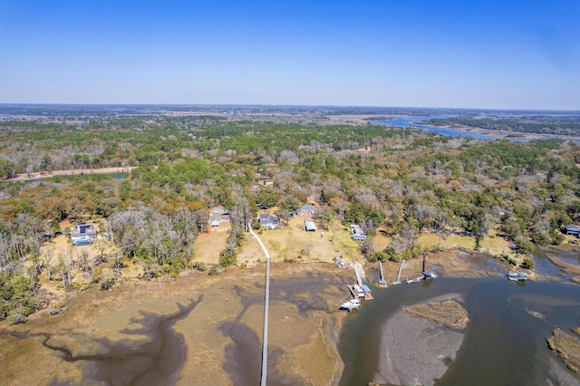 birds eye view of property with a wooded view