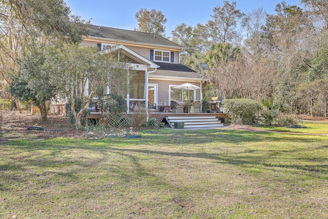 exterior space with a wooden deck and a front lawn