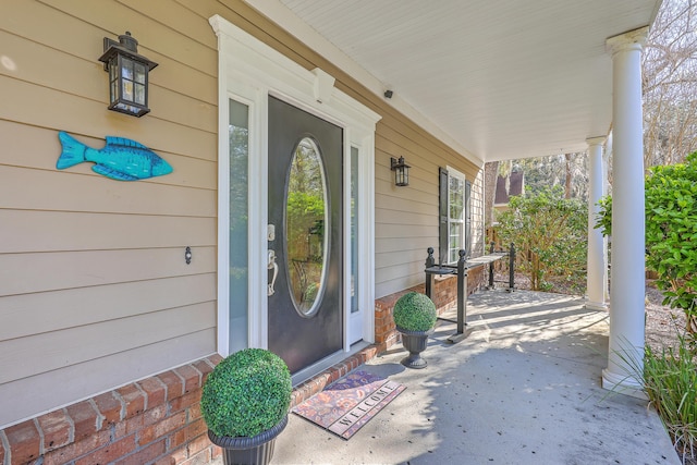 doorway to property featuring covered porch