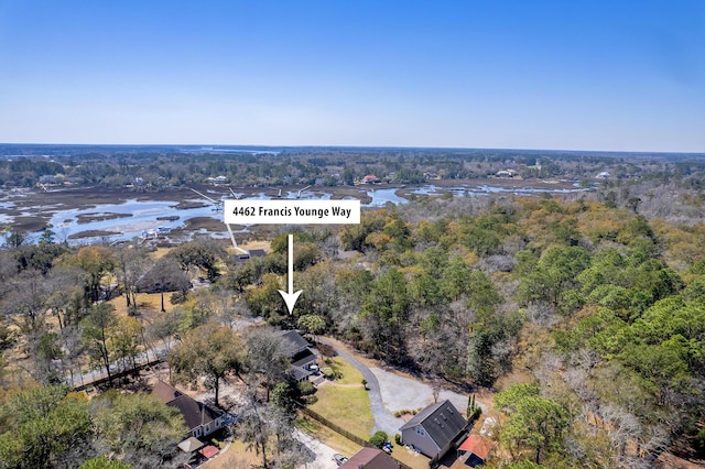 bird's eye view with a forest view and a water view