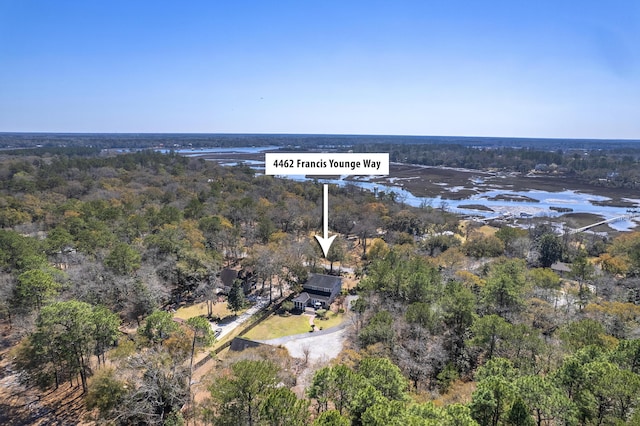 aerial view with a forest view and a water view