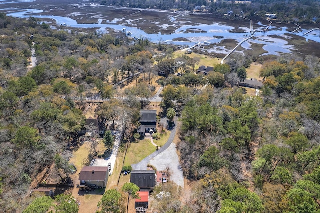 aerial view featuring a view of trees and a water view