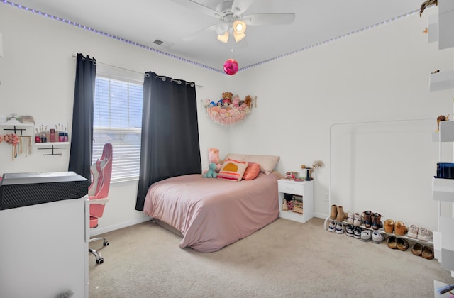 carpeted bedroom with ceiling fan