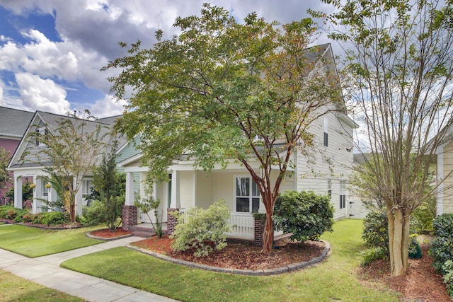 view of front of house featuring a porch and a front yard