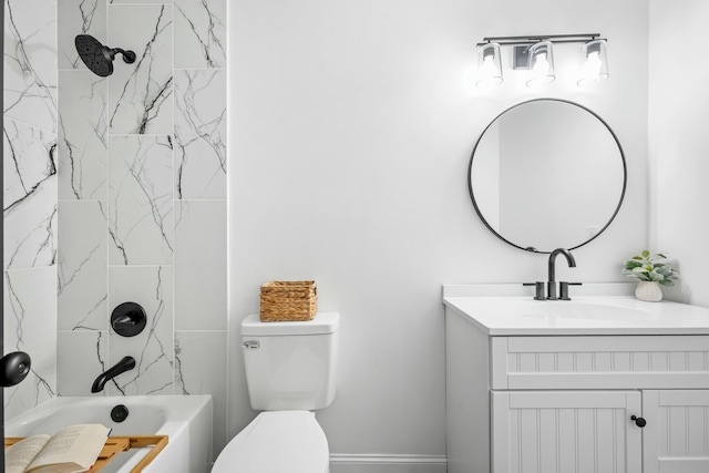 bathroom featuring washtub / shower combination, vanity, and toilet