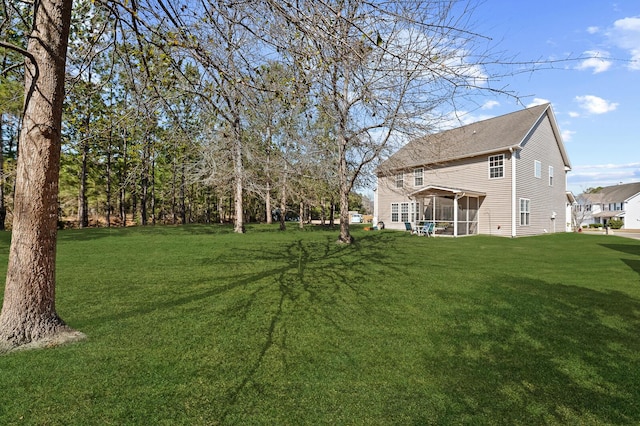 view of yard featuring a sunroom