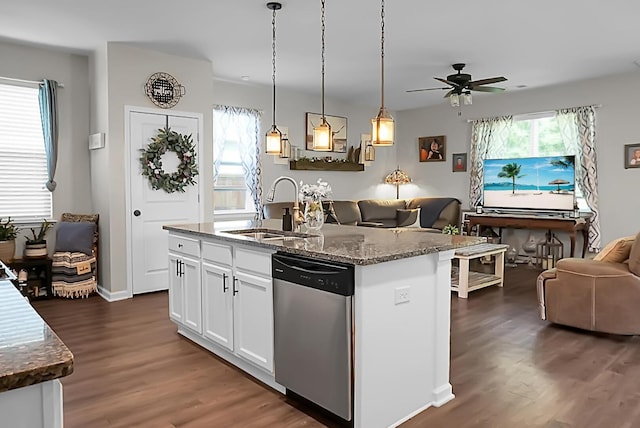 508 Glady Rd, Moncks Corner, SC 29461 - kitchen with stainless steel dishwasher, open floor plan, a sink, dark wood finished floors, and dark stone countertops