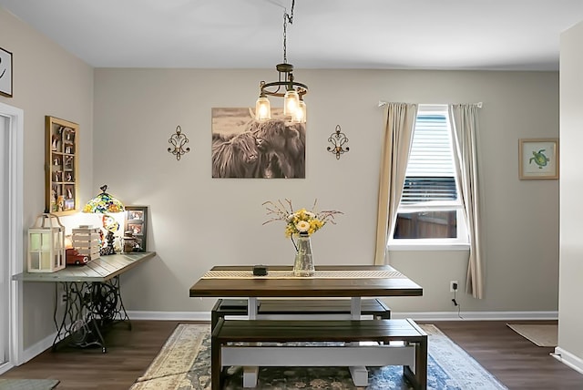 508 Glady Rd, Moncks Corner, SC 29461 - dining area with dark wood-style flooring, a chandelier, and baseboards