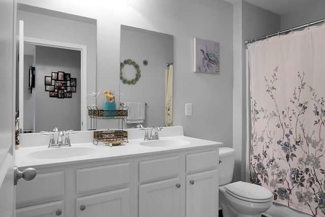 508 Glady Rd, Moncks Corner, SC 29461 - bathroom with double vanity, toilet, and a shower with shower curtain
