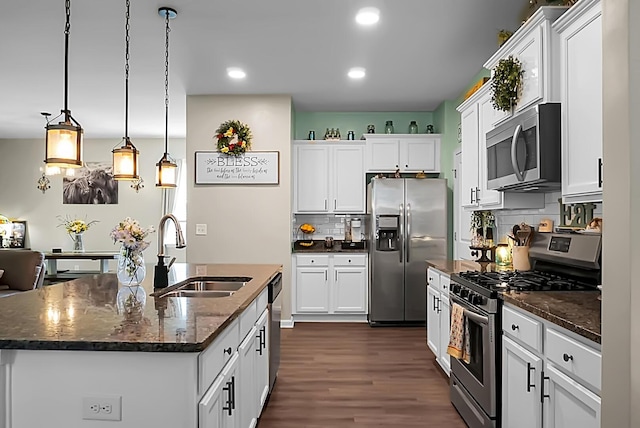 508 Glady Rd, Moncks Corner, SC 29461 - kitchen with stainless steel appliances, a sink, dark wood-style flooring, backsplash, and white cabinets