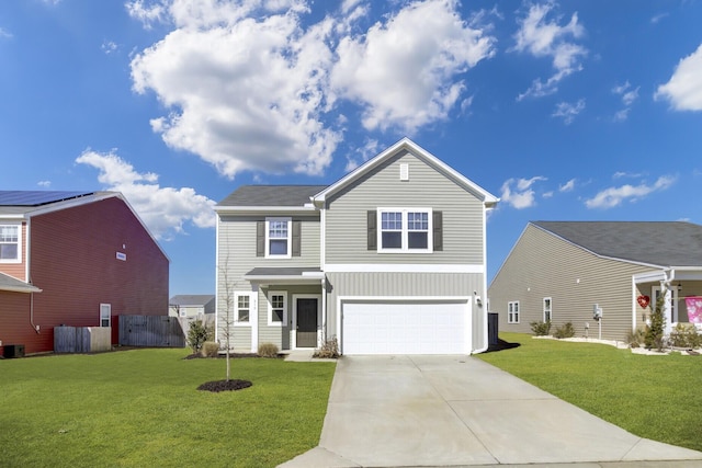 view of property with a garage and a front lawn