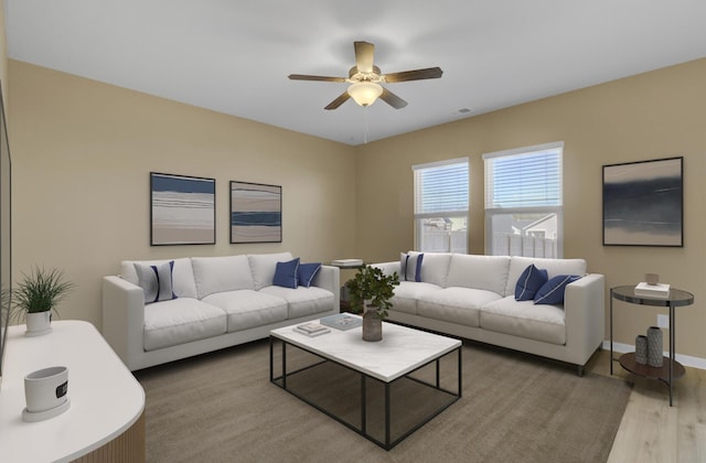 living room featuring wood-type flooring and ceiling fan