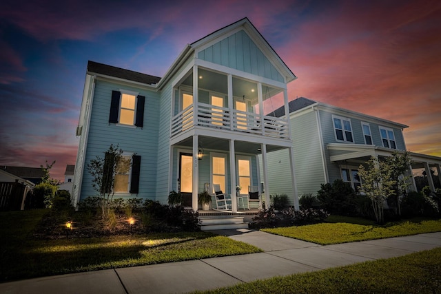 403 Cool Bend Ln, Summerville, SC 29486 - view of front of house with a porch, a balcony, board and batten siding, and a front yard