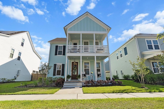 403 Cool Bend Ln, Summerville, SC 29486 - view of front of home with covered porch, a balcony, board and batten siding, and a front lawn
