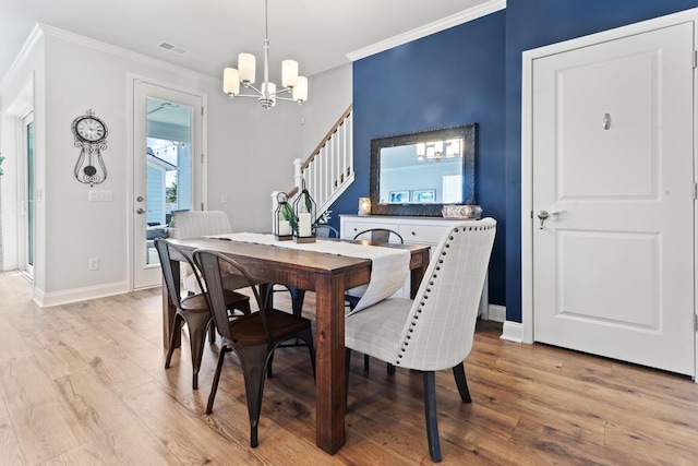 403 Cool Bend Ln, Summerville, SC 29486 - dining space with a chandelier, ornamental molding, light wood finished floors, stairs, and baseboards