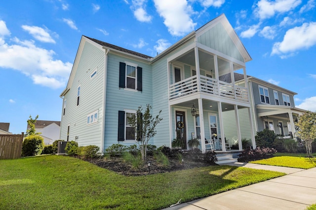 403 Cool Bend Ln, Summerville, SC 29486 - view of front facade with a balcony, a porch, a front yard, and central AC