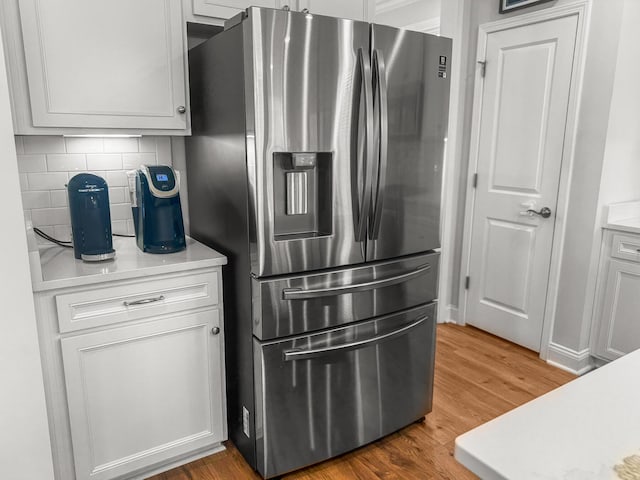 403 Cool Bend Ln, Summerville, SC 29486 - kitchen with stainless steel refrigerator with ice dispenser, light countertops, backsplash, and wood finished floors